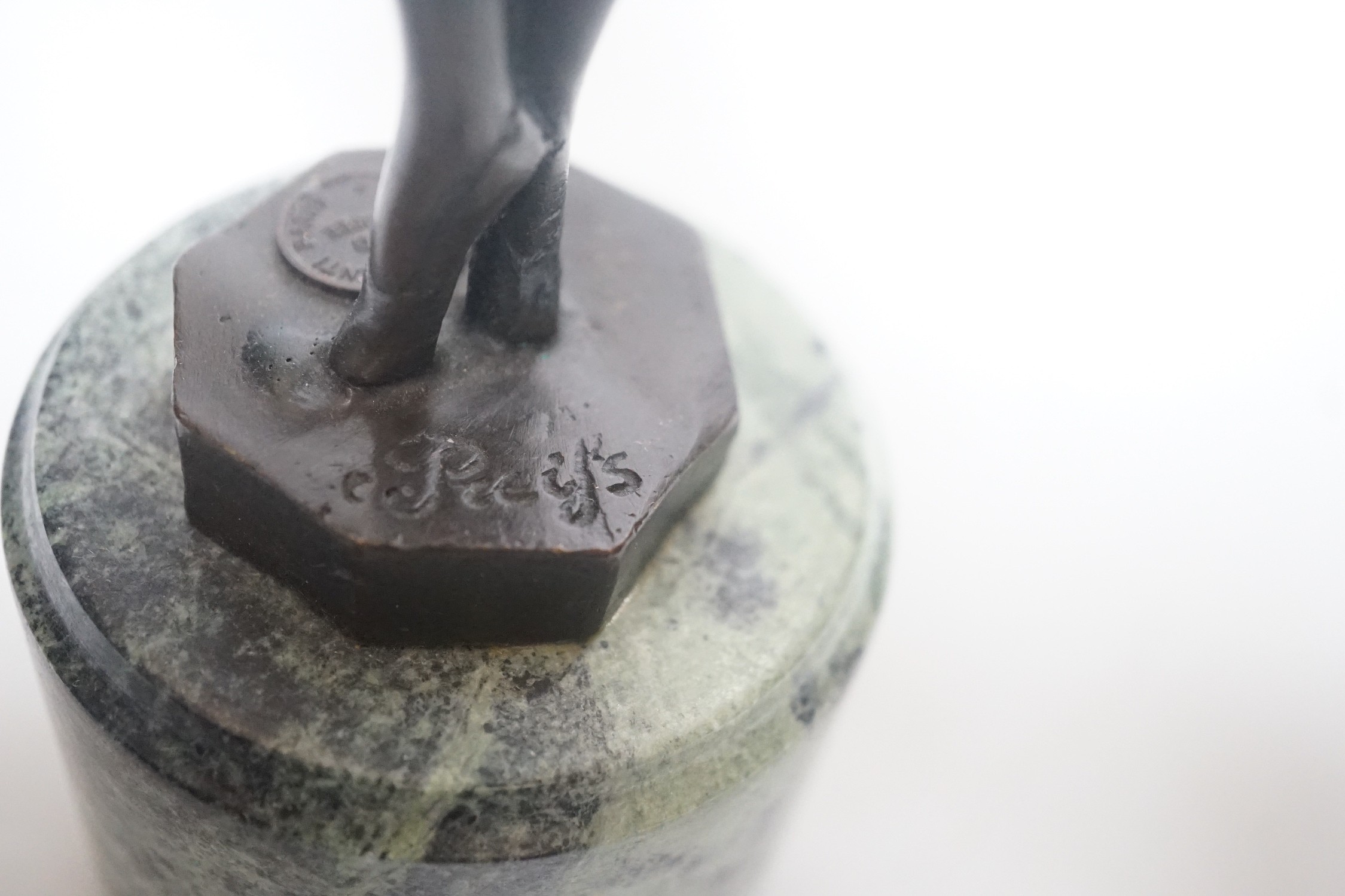 After Ferdinand Preiss (1882-1943), a bronze of a curtsying girl, on marble base, 27cm